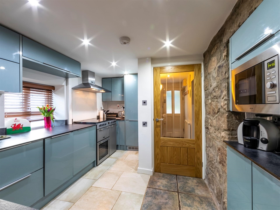 Extremely well equipped and with a large range cooker it is open plan to the dining area