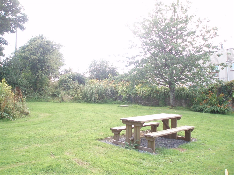 The enclosed garden is shared with the neighbouring holiday cottage.