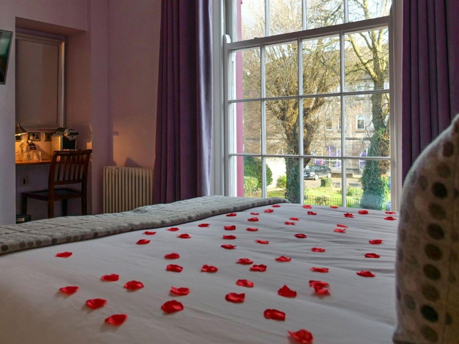 Rose petals on the bed make your holiday even more romantic! Pictured: rose petals on the bed in Illimani room, a classic room in the Morgans Townhous