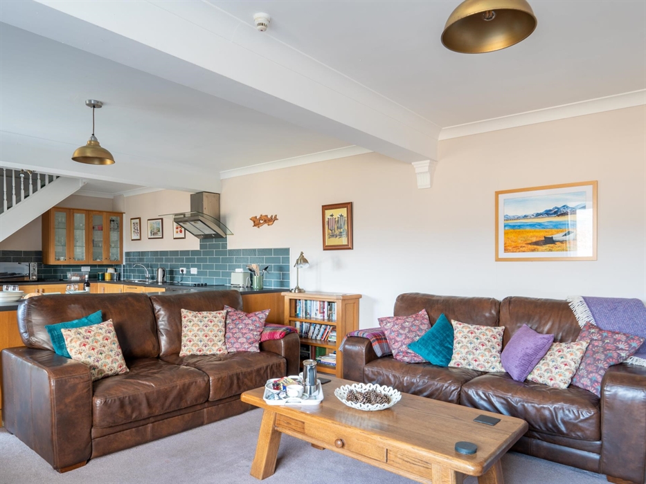 Large leather sofas in comfortable lounge of five star North Wales holiday cottage