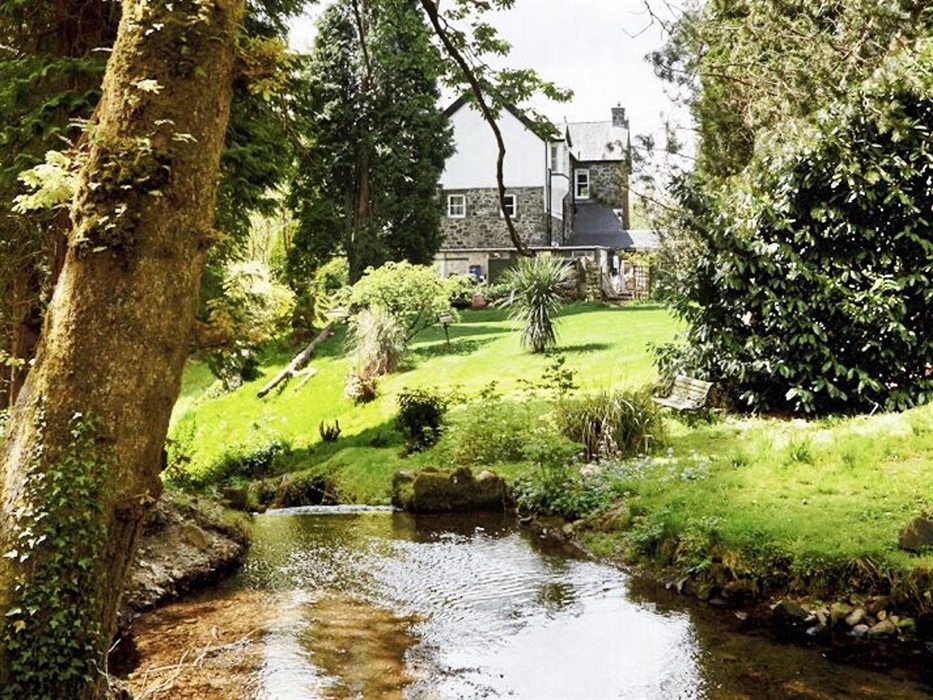 View of house from the victorian pool in spring
