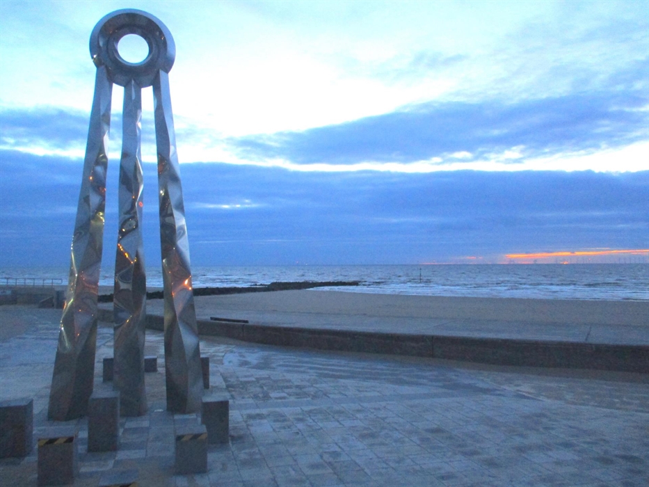 A 6 meter tall statue of a ring on 3 legs, It is called the beginning and end statue to signify the start or finish of the Offa's Dyke Path. It is loc