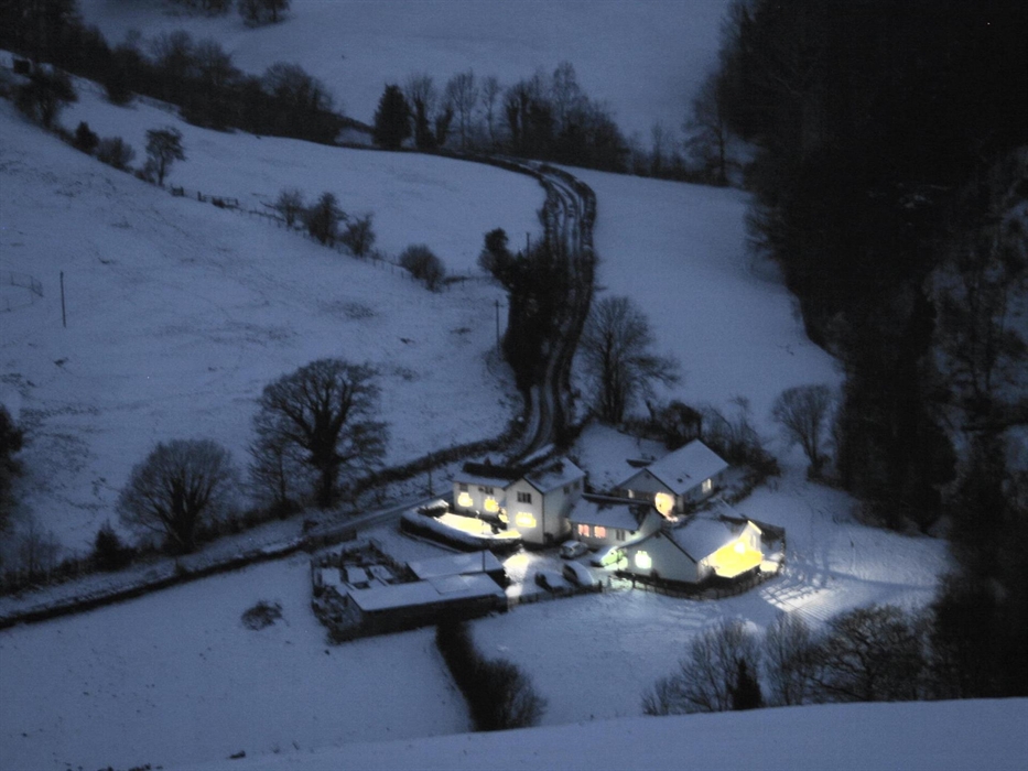 Photograph taken from the top of our nearest hill of Madogs Wells In the snow and fully occupied.