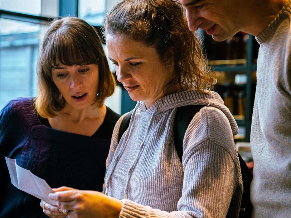 A team discovering a communication from a Wonderland Character.