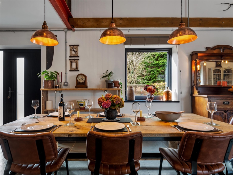 ample seating for 6, many antique items on the walls and mirrored dresser.