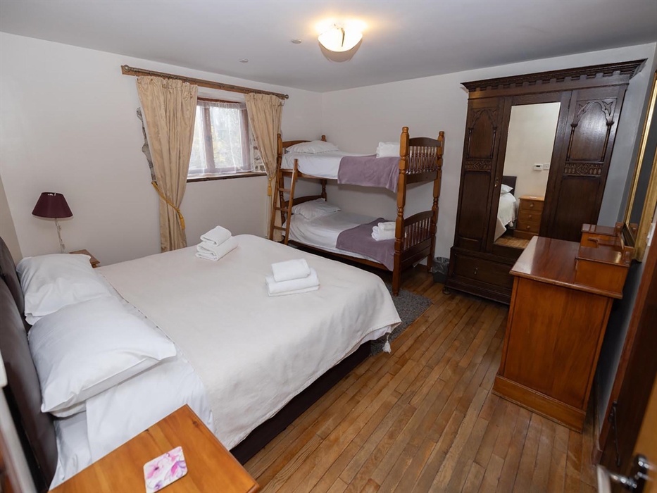 The Stables, bedroom 2 has a superking bed and bunk beds