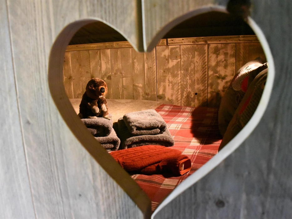 A double bed in a cosy cabin