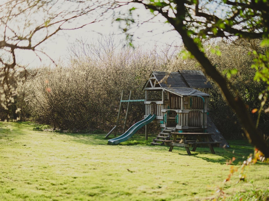 A tender moment captured at the children's play area, young adventurers exploring with joyous abandon