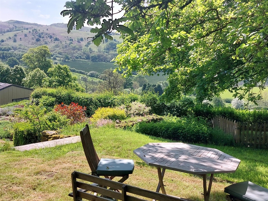 Table and 4 chairs in the garden area with views over the hills.  Plenty of shade if needed.