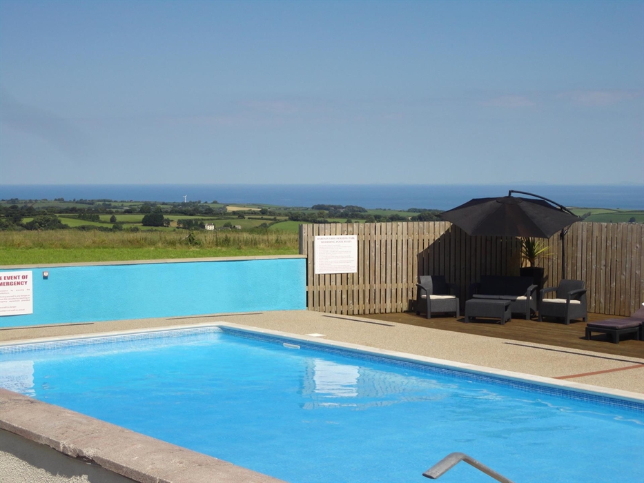 Our outdoor heated pool enjoys fabulous views overlooking cardigan Bay and beyond
