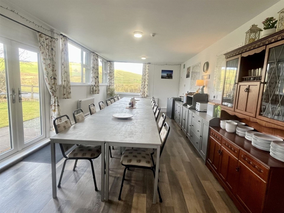 Our large bright dining room has amazing views across the valley.