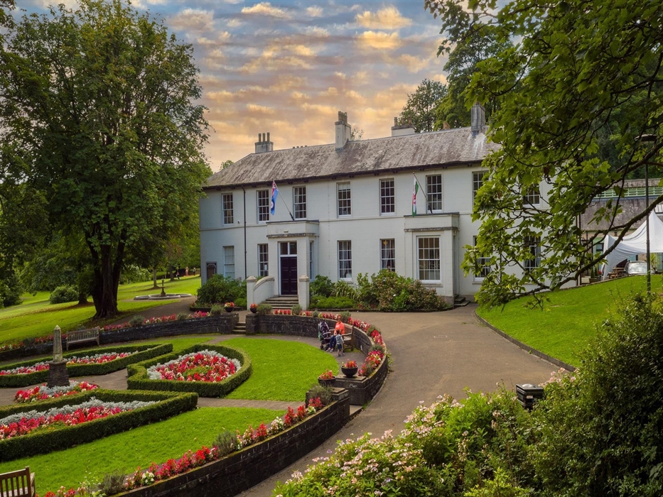 The main house with the circular gardens in the front of the house.