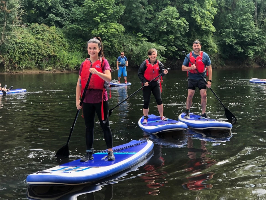 Stand-up paddleboarding on the River Wye in the Wye Valley Monmouthshire Wales for all, families, friends & team building days out.