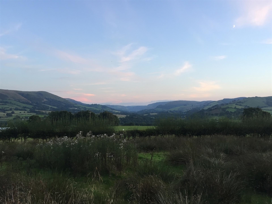 Set in 10 acres of rural pastureland, every room has impressive views of the surrounding Cambrian Mountains and rolling hills.