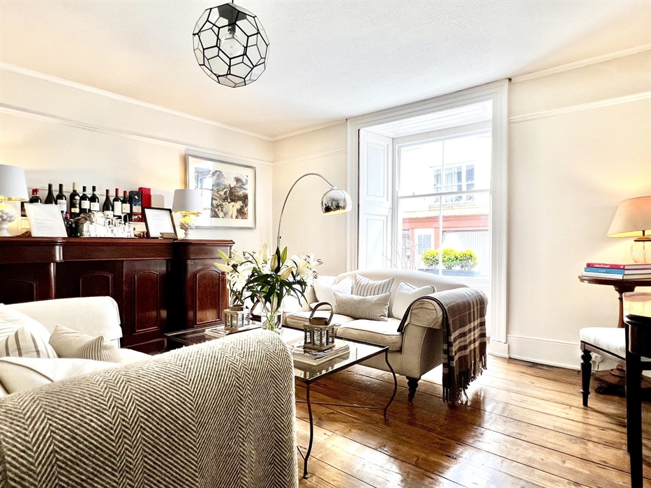 We have a large open area around reception with 2 guest lounges. There are comfy sofas and chairs and an honesty bar in this one. The adjacent room ha