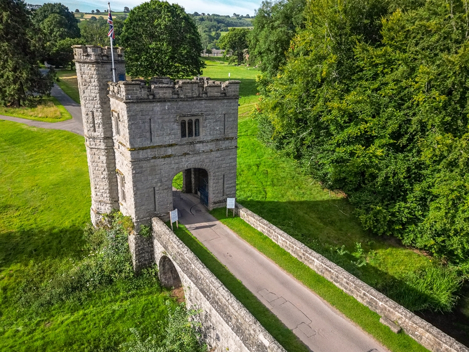 Stone tower with bridge surrounded by beautiful parkland and trees on Glanusk country estate