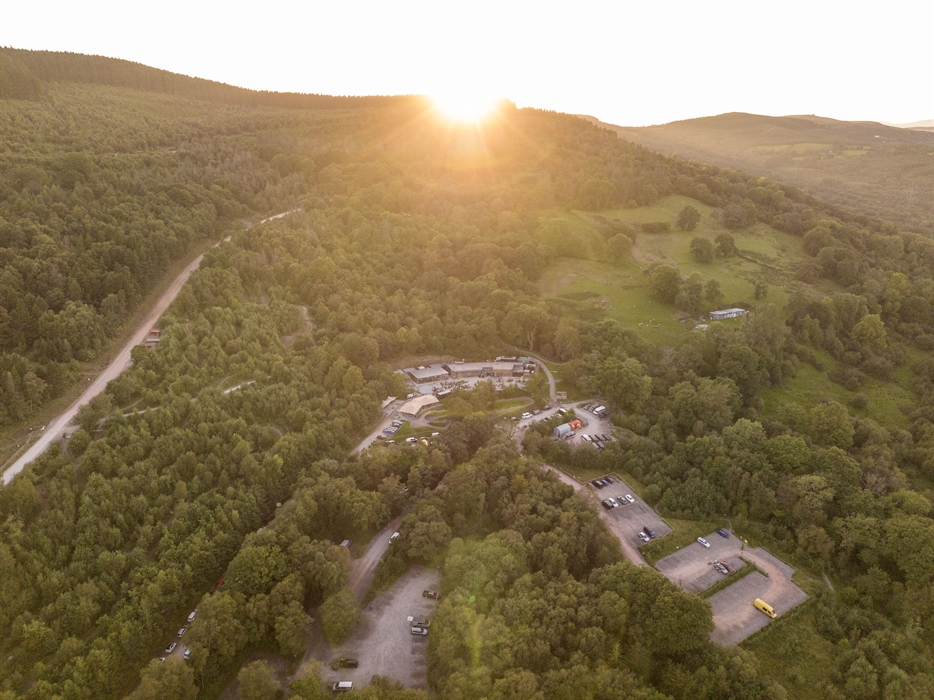 Drone shot of the park with the sun setting behind