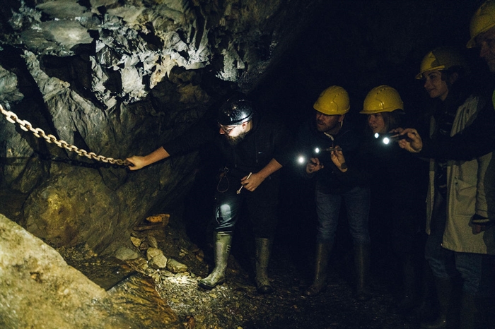 Inspecting items abandoned, and forgotten, in the old Welsh slate mine with Corris Mine Explorers
