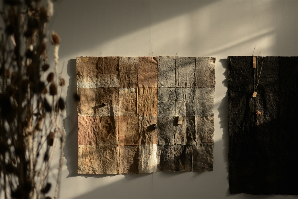 A patchwork paper installation by Jane Ponsford, made using collected materials from walk around Wales.