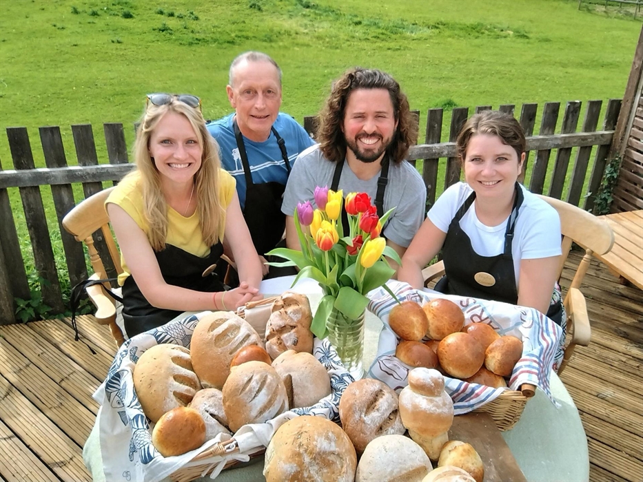 Class participants with some of the seven types of bread they make during the class