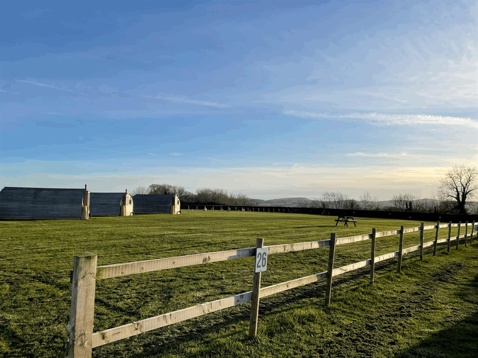 Autumn morning on campsite showing glamping pods and pitches
