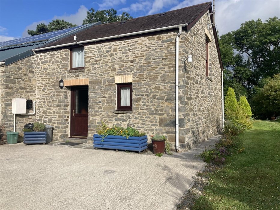 From the front.  There is plenty of car parking and a socket / untethered Type 2 electric vehicle charge point - i.e. bring your own charger. The bwyt