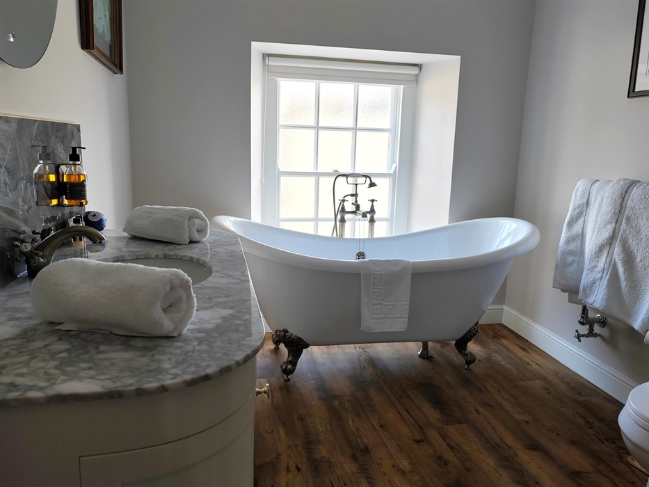 Extra large super king bathroom, traditional free standing roll top bath in our light and fresh bathroom