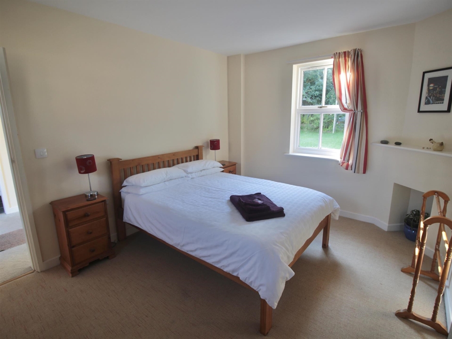 Spacious bedroom with tranquil garden views