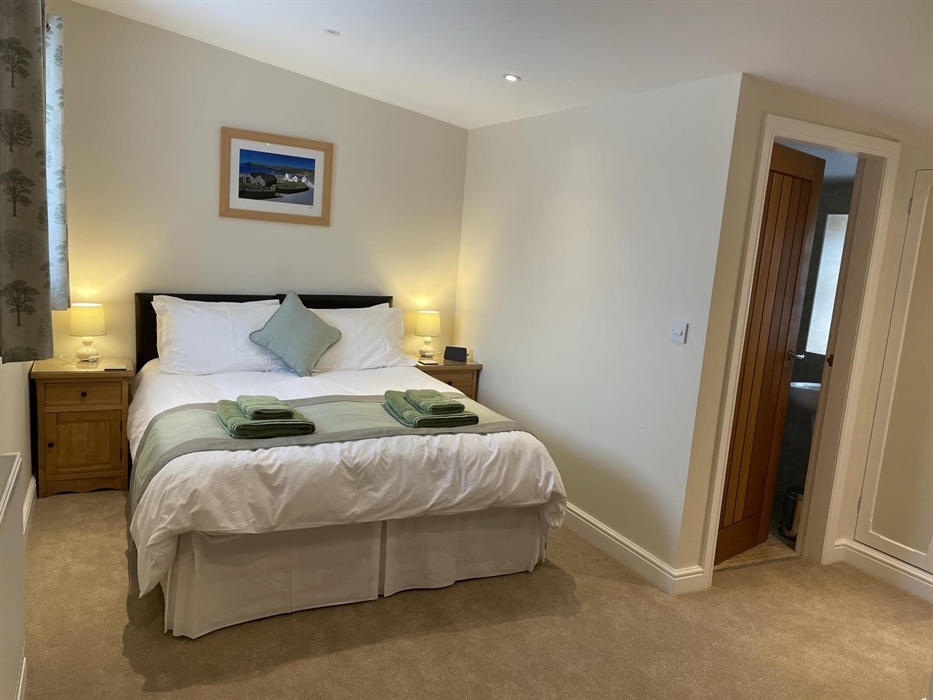 second bedroom shown as a double room with 5' king bed & en-suite shower room