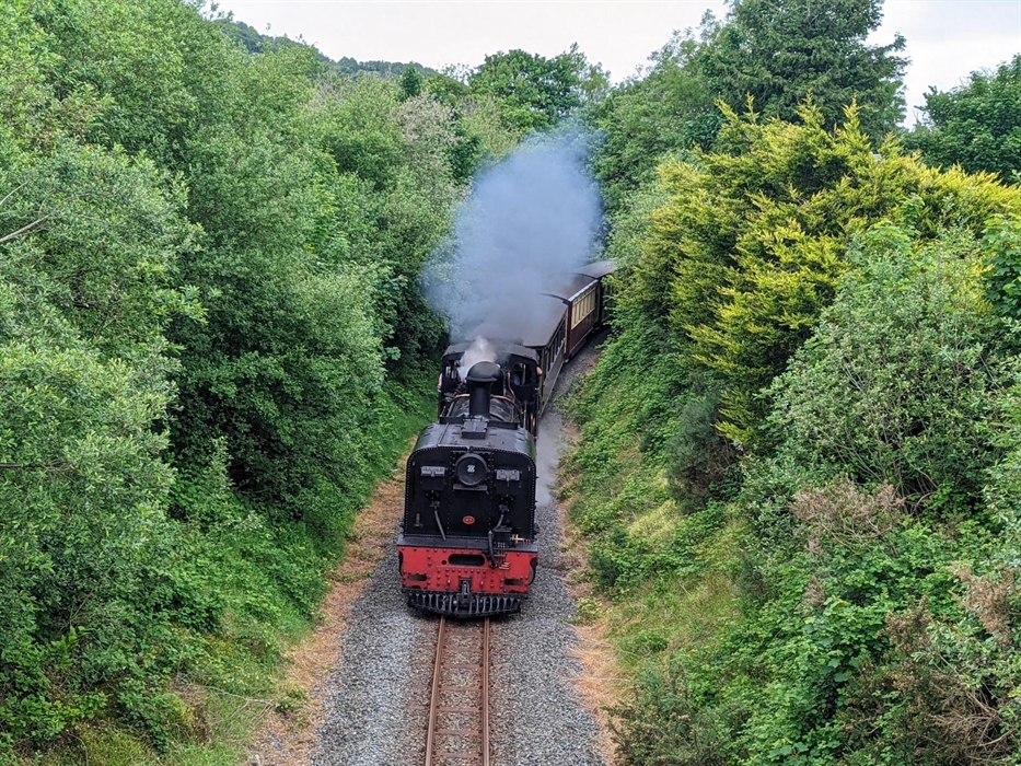 Steam train running through Bryn Gloch Caravan & Camping Park