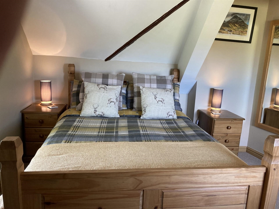 A double room for 2 with ensuite shower. Over looking the lake to front and across to the Snowdonia Mountain range from the side windows.
