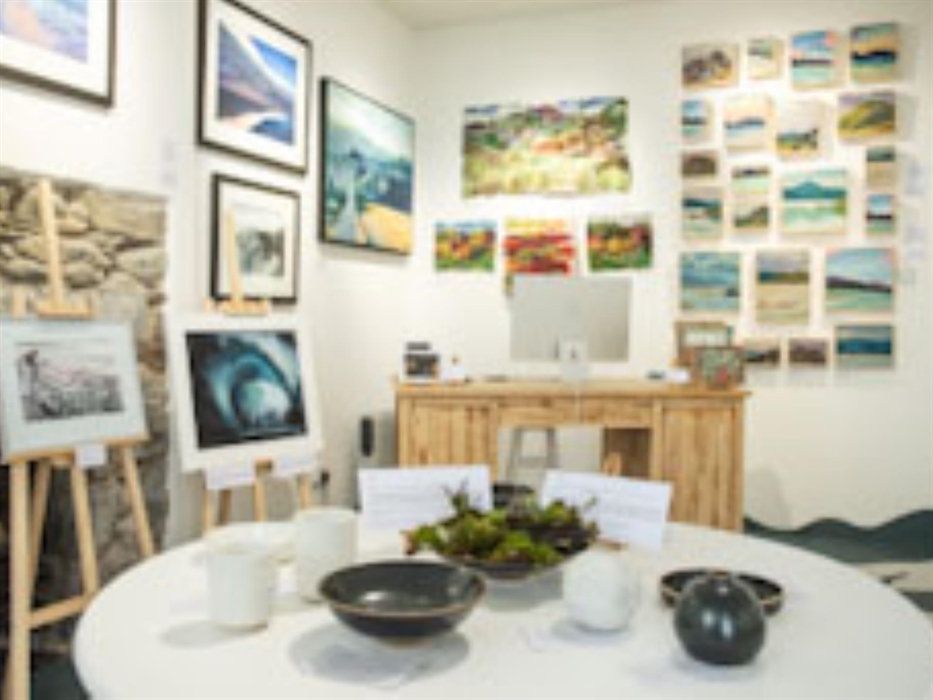 View of inside the gallery with artworks on the wall.