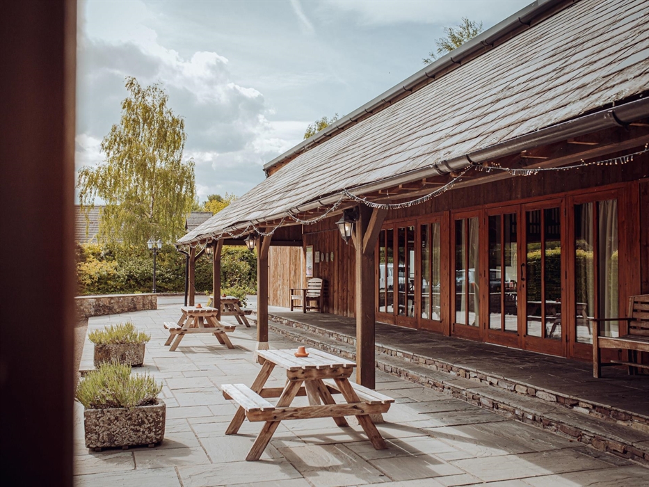 Picnic benches outside in the front courtyard area