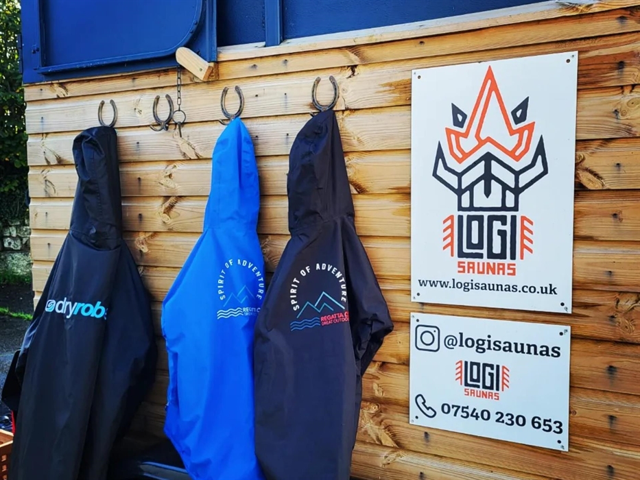 Enjoy the cozy ambiance of Logi Saunas at Wild Lakes while hanging up your dry robes, embracing the soothing warmth and comfort within the inviting sa