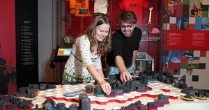 Visitors using the Build Your Own City interactive