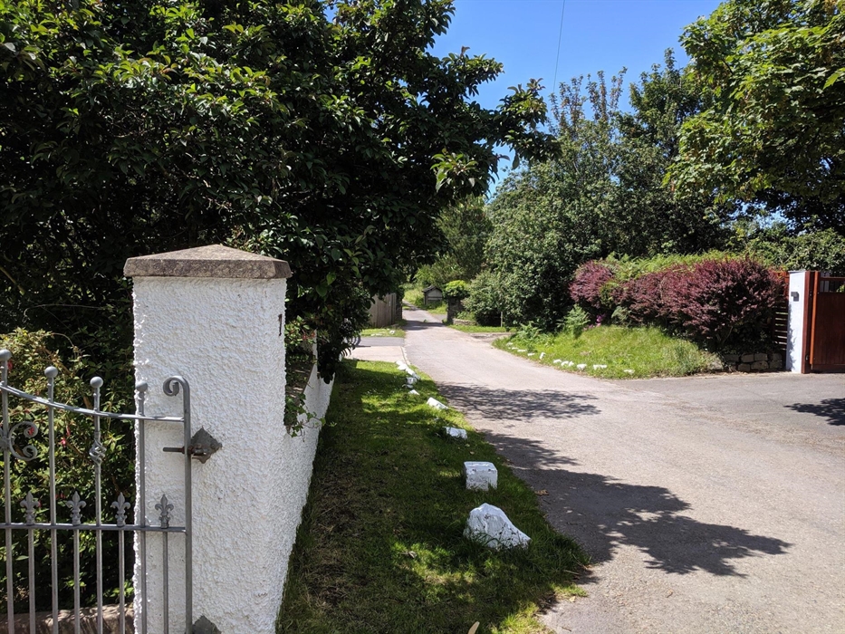 Settled on a private road leading to coastal path.