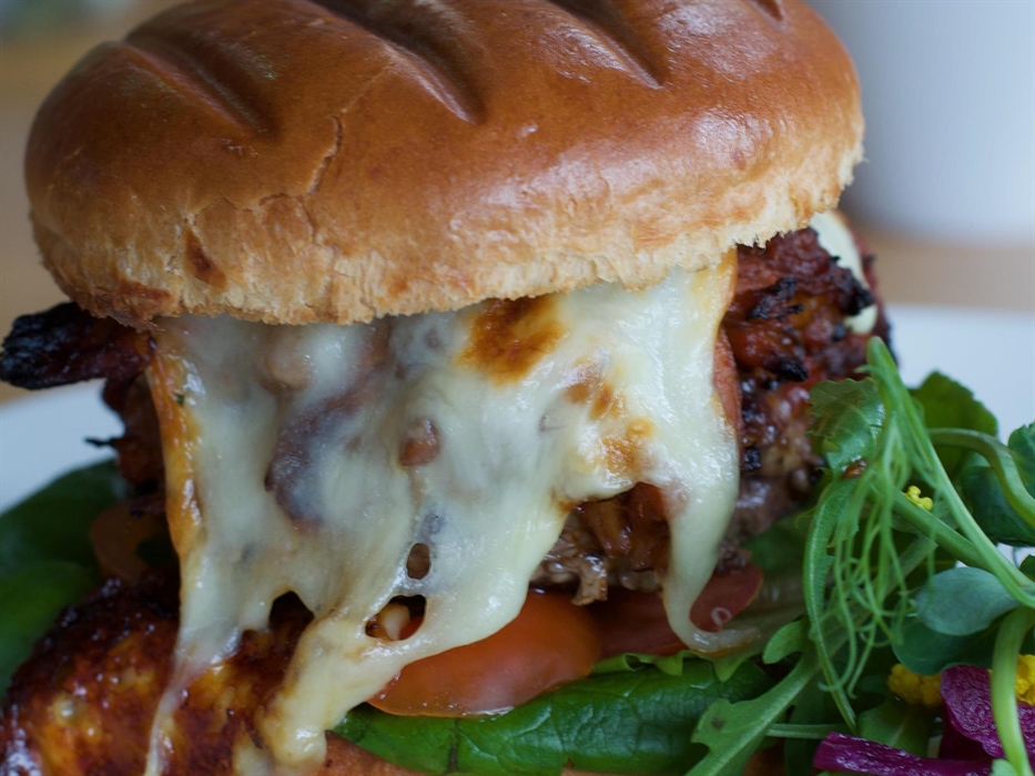 Our signature pulled pork, mozzarella beef burger