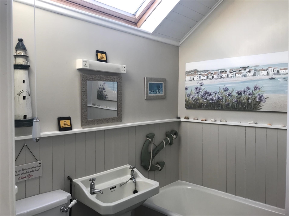 This is the bathroom in the cottage, you also have a small shower bathroom .