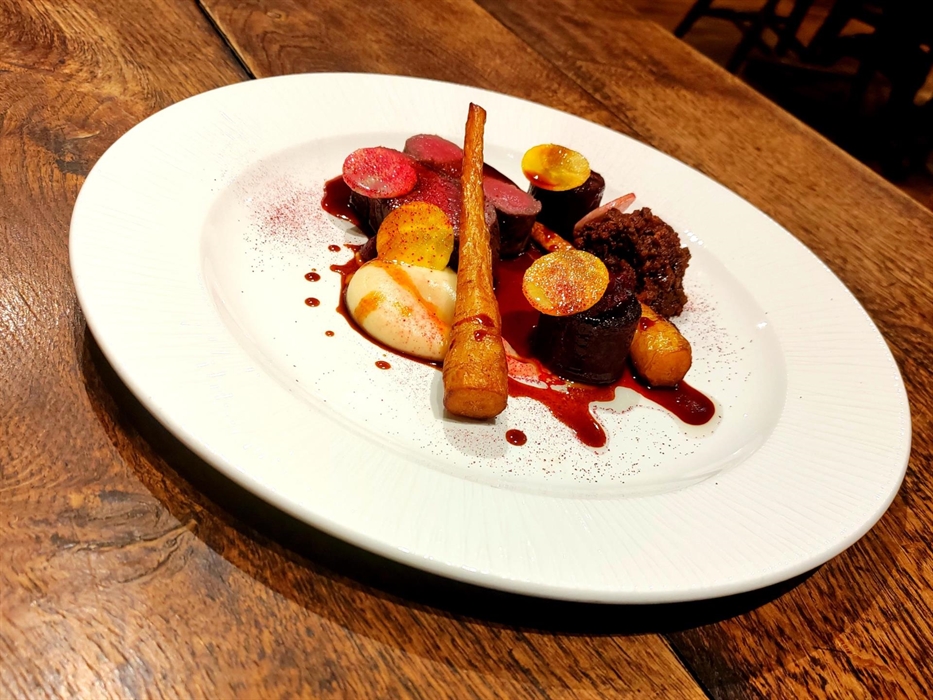 Venison strip loin & ragu from the venison center, piccolo parsnip, beetroot fondant, game jus