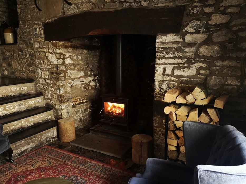 Sit back and relax after a meal next to our cosy wood fire.