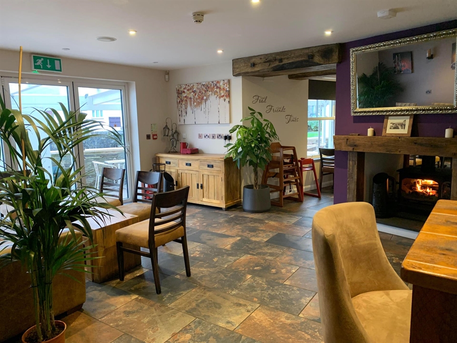 Sofa area with log burning stove