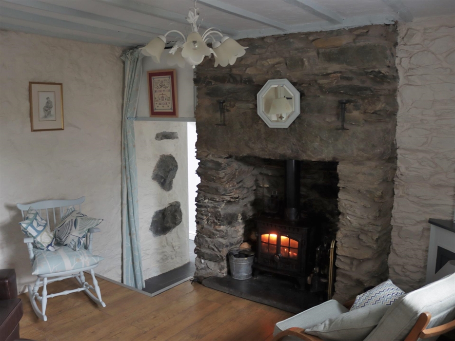 Two steps down to ground floor kitchen/dining area, utility room. Shower Room, Double Bedroom. Fuel for stove provided, no charge.