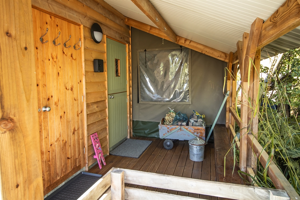 Veranda entrance porch for storing wood, coats and boots, a great place for sitting and having a morning coffee! Key safe box for storing the door key