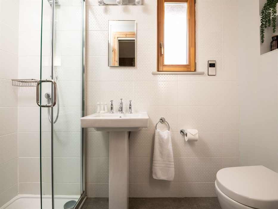 This fresh crisp bathroom is in keeping with the Scandi theme