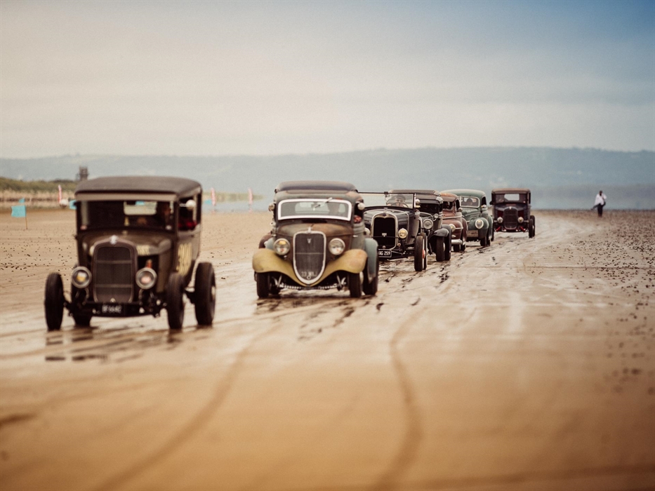 Vintage Hot Rod Association cars lined up on Pendine Sands. They visit Pendine and the Museum of Land Speed every June.