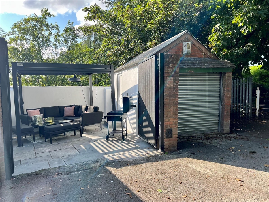 Our new patio area with pergola and quality furnishings, plus BBQ with entrance to Bike lock up through PVC door. Patio heater and lockable gate make