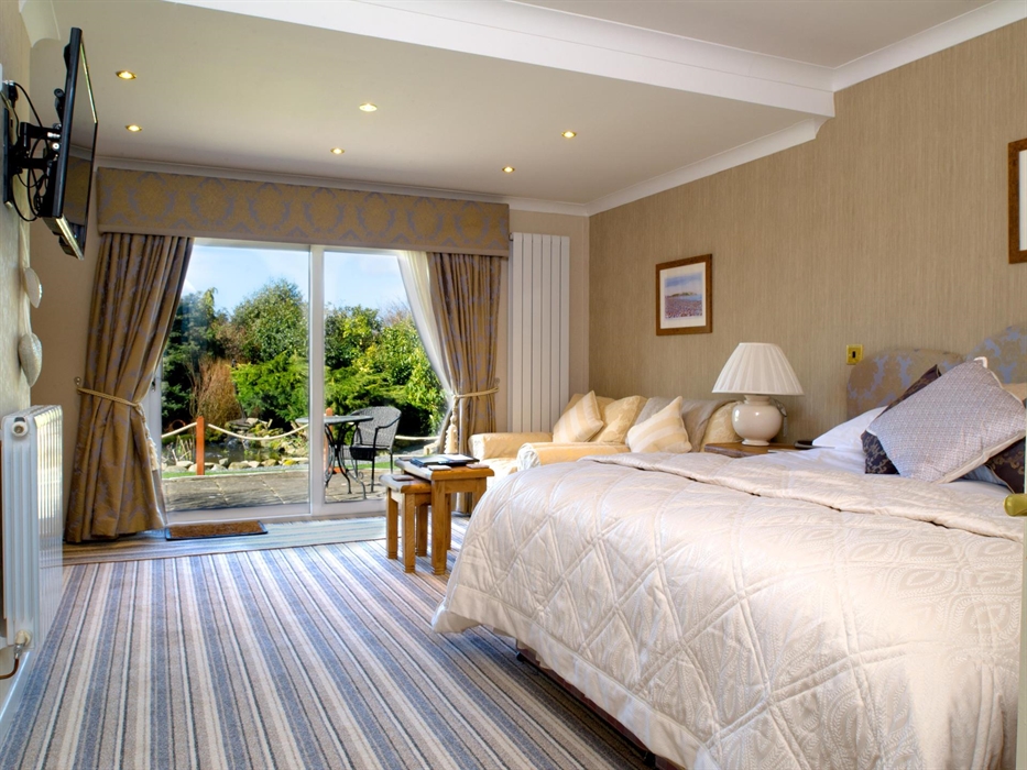 Ground floor superior bedroom at Ty'n Rhos country house