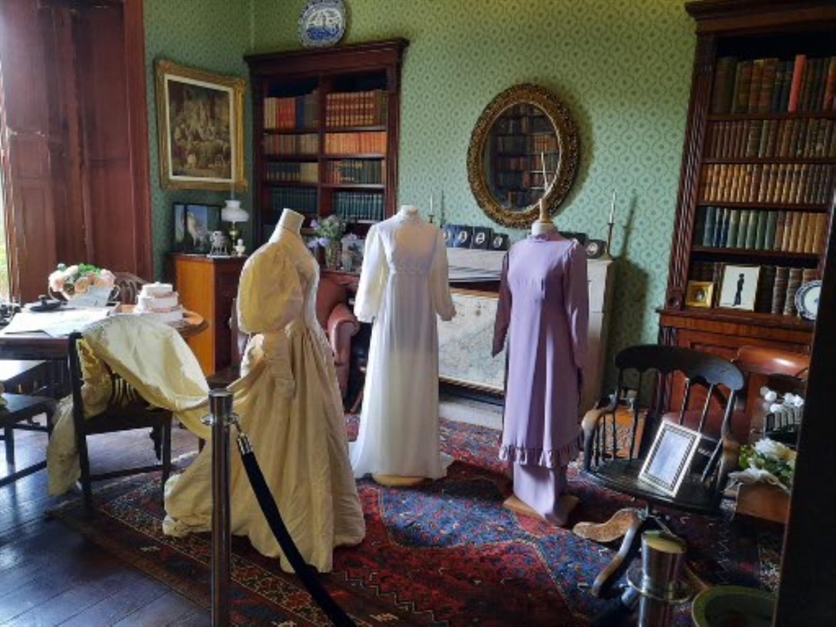 Display of period costume in the library at Scolton Manor