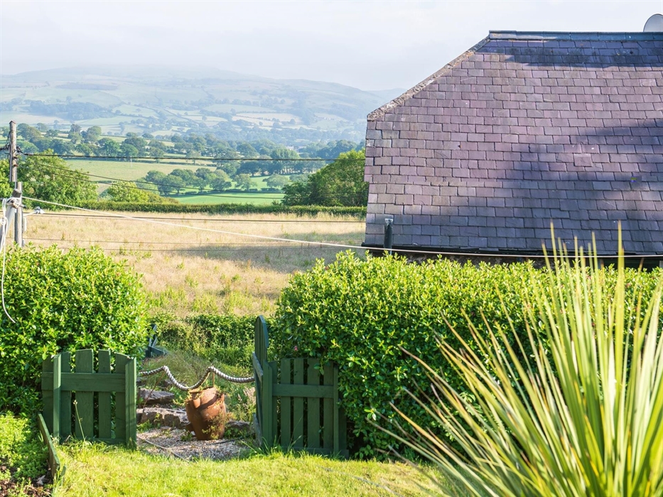 There is a lovely view from the garden.  During summer months there are 2 sun loungers available along with a firepit and a gas BBQ.  The summerhouse