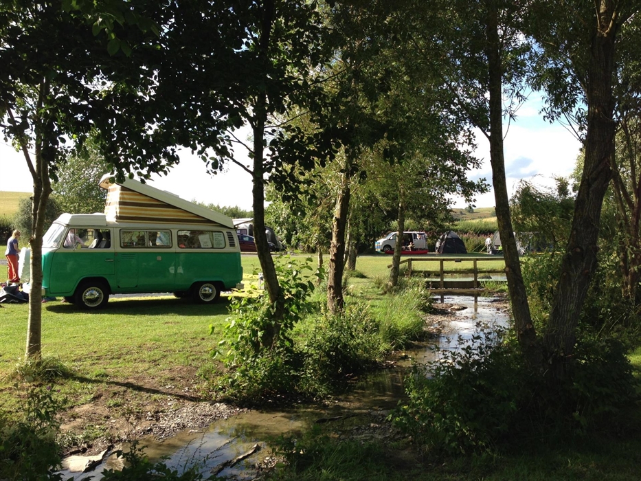 Campervan by stream